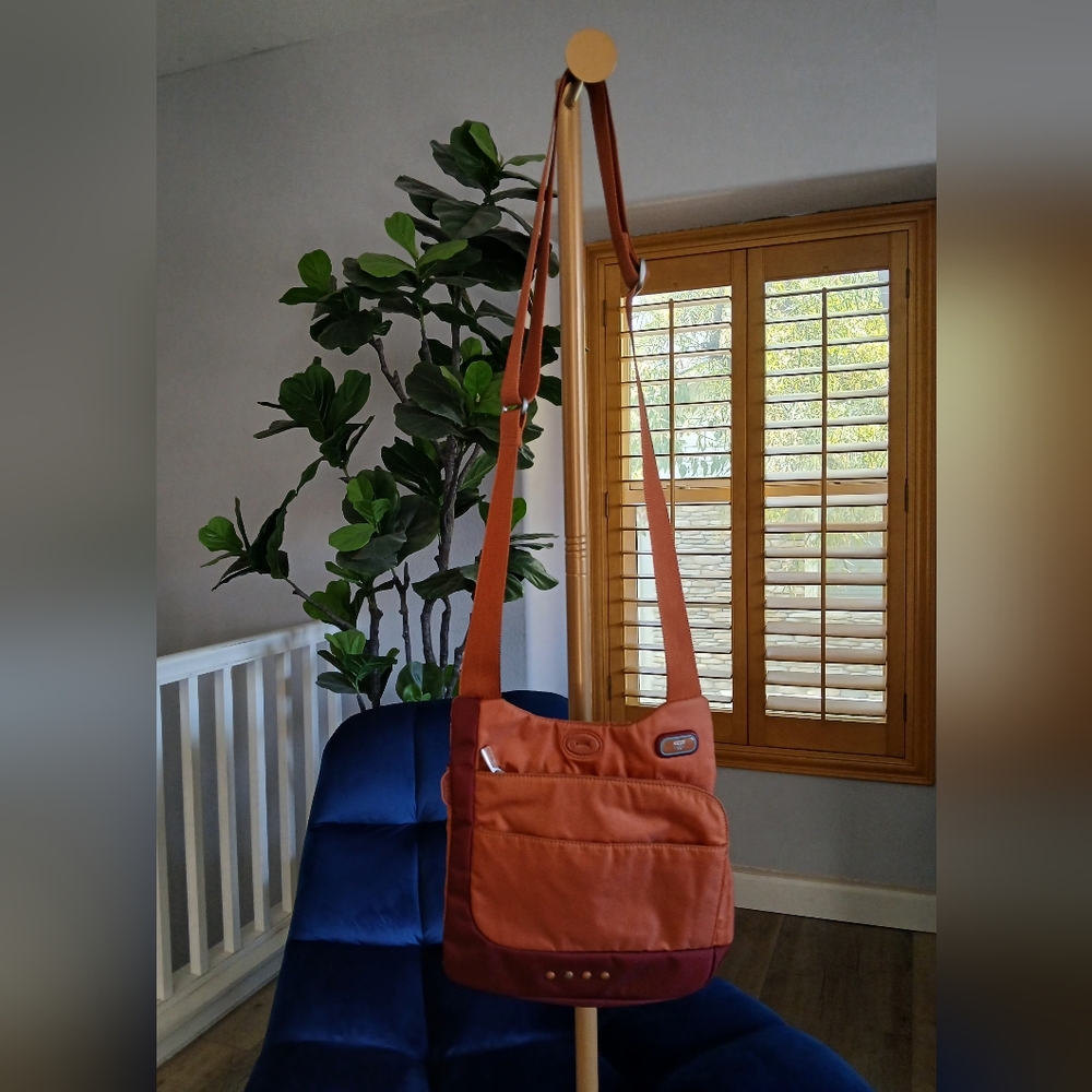 Tumi T-Tech Nylon McKenna Crossbody Bag in Burnt Orange. 5132CND